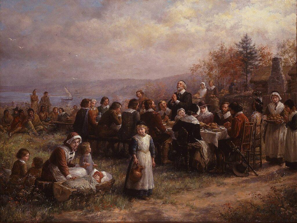 Festa del Ringraziamento: Thanksgiving at Plymouth, 1925, Brownscombe. Immagine di pubblico dominio via Wikimedia Commons.
